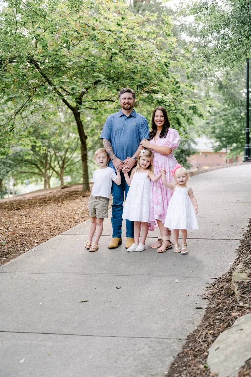 The Crisp family on a tree-lined path